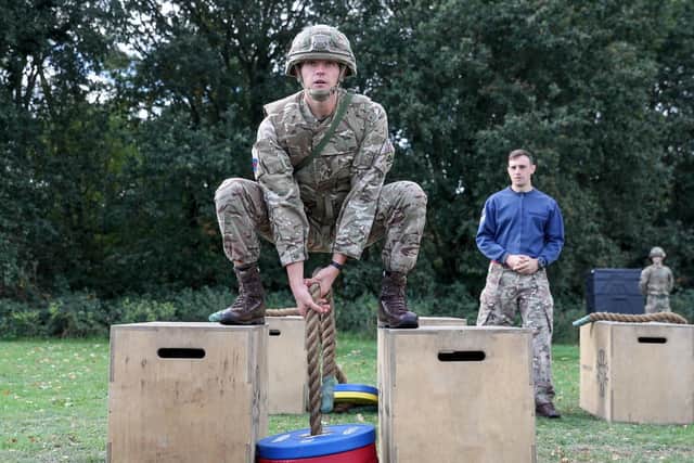 Soldiers demonstrate the vehicle casualty extraction stage in the British Armys New Physical Employment Standards (Fitness Tests) for Close Combat Soldiers at the Royal Army Physical Training Corps School in Aldershot. PHOTO: Andrew Matthews/PA Wire