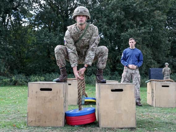 Soldiers demonstrate the vehicle casualty extraction stage in the British Armys New Physical Employment Standards (Fitness Tests) for Close Combat Soldiers at the Royal Army Physical Training Corps School in Aldershot. PHOTO: Andrew Matthews/PA Wire
