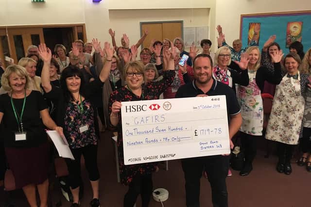 The cheque is presented to Gafirs. Picture: Gafirs on Twitter (@Gafirs)