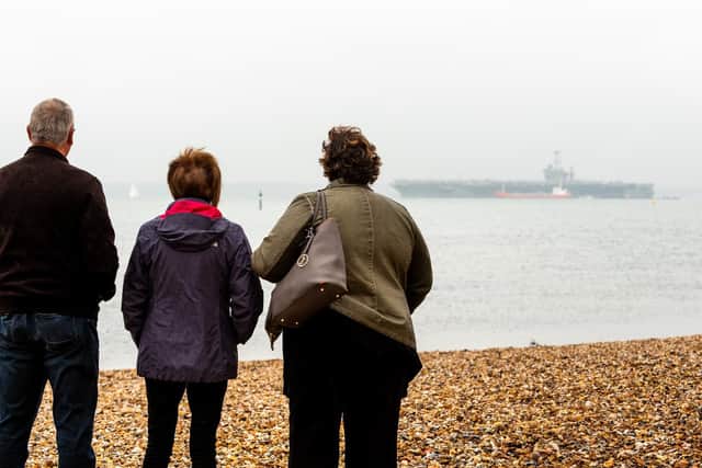 Alan and Brenda Scott from Stubbington with their friend Yvonne Young from Gatwick were viewing the giant ship Picture: Vernon Nash (180676-054)