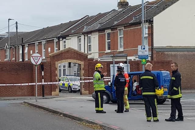Police and firefighters have cordoned off Asda car park in Fratton after reports of man on three-storey building nearby. Picture: Habibur Rahman