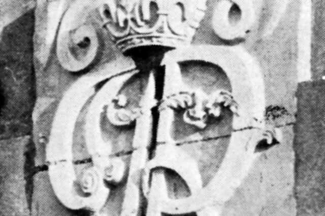 One of the two King Jamess monograms originally in the Camber side wall of the White Hart Barracks