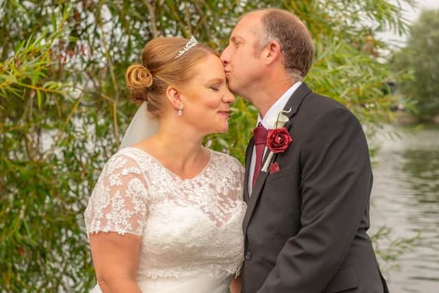 Graham plants a sweet kiss on his bride.