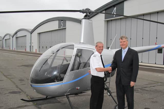 Fareham Borough Council leader Cllr Sen Woodward (right) with Paul Andrews, managing director of Phoenix Helicopters, at Solent Airport at Daedalus.