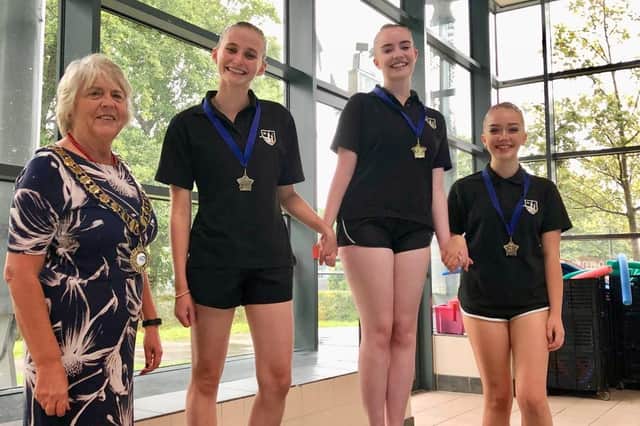 Jenny Gray MBE with medal winners, from left to right, Emily Jupe, Isabel Benson and Marianne Shaul