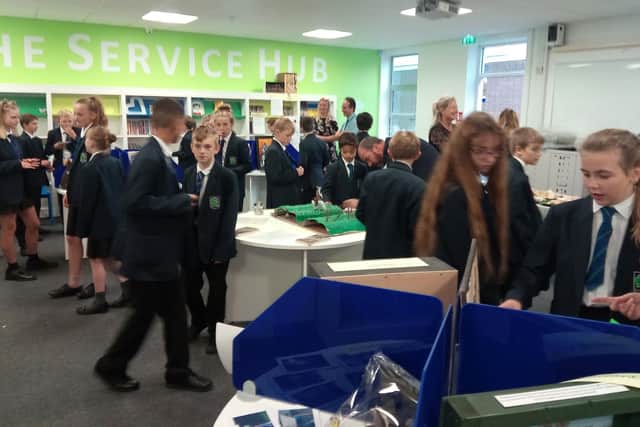 Children enjoy a finalists lunch as they explore each others' work