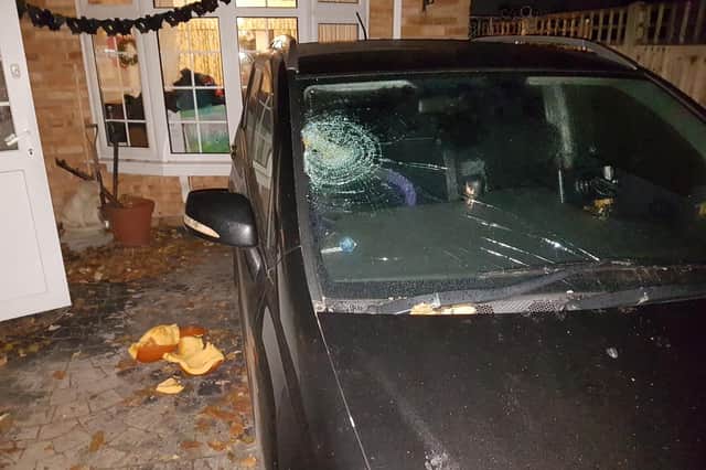 The damage to the Clostermanns' Honda FRV and the pumpkin found smashed next to it. Picture: Wolf Clostermann