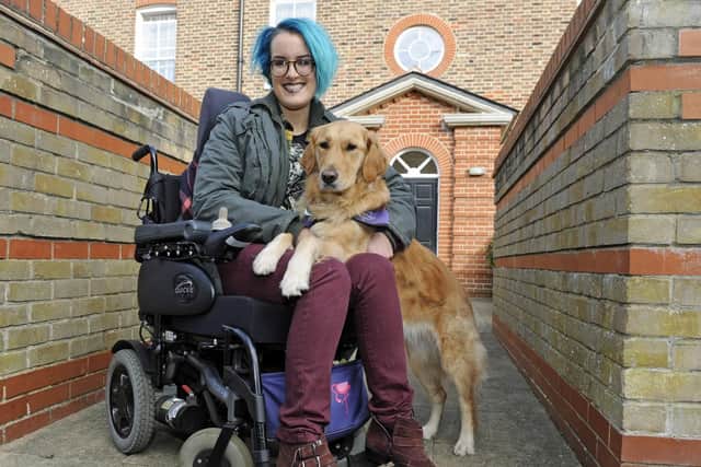 Milton resident Rachel Rawlings who suffers from ME, with her partner dog Darcy who has transformed her life. Picture Ian Hargreaves