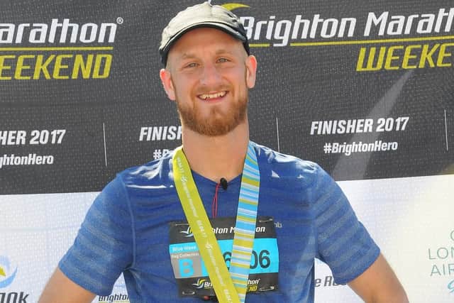 Stephen Mullins with his medal at the Brighton Marathon last year
