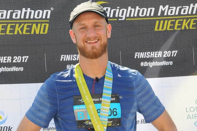 Stephen Mullins with his medal at the Brighton Marathon last year