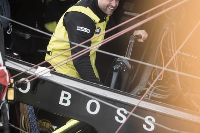 Gosport yachtsman Alex Thomson on board his IMOCA Open60 race yacht 'Hugo Boss' at the start of the race. Picture: Lloyd Images
