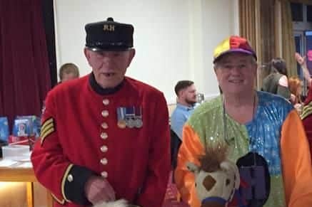 Les Heyhoe BCAv, right, during the horse race night at HMS Sultan