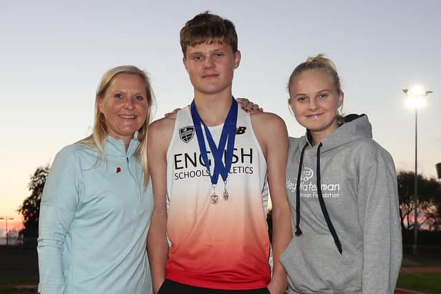Double international medal winner Elliott Evans with his mum Natalie and sister Freya. Picture: Paul Smith