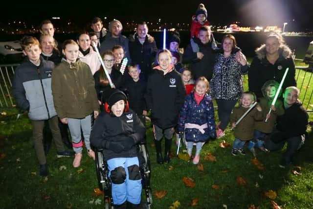 Friends and family waiting for the bonfire to be lit