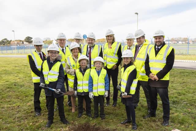 Local pupils from Lee-on-the-Solent Junior School, bury a time capsule at Daedalus Village with veterans Mollie and Eddie Rees