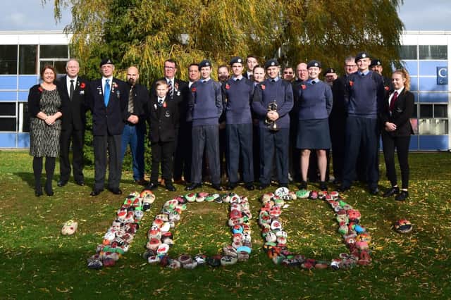 Pupils and teachers mark Remembrance at Fareham Academy after the rain cleared