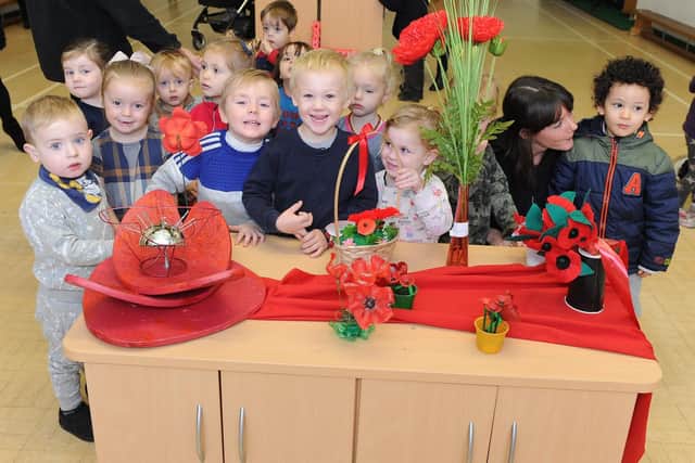 Manor Nursery school children exploring the poppies that were made
Picture: Habibur Rahman
