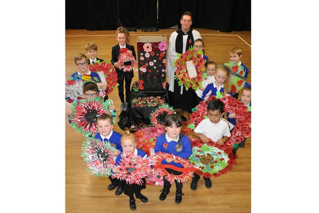 Lilly Amber Gurr, Sam Sands, George Jones, Finley Smithy, Maizie Rowley, Isis Bird, Ruben Lilly, Charlee Clarke, Kaiden Tait, Esmay Mabbs, Maggie Stewart, Father Marcus at Arundel Court Junior School in Portsmouth