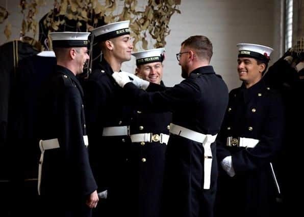 Royal Navy personnel doing remembrance events receive special coins commemorating the day. Picture: Royal Navy