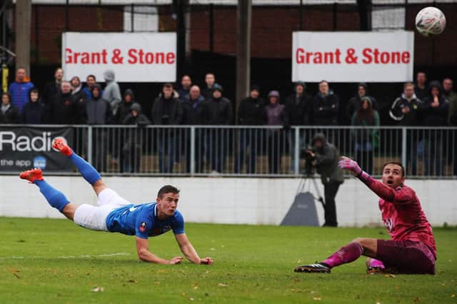 Substitute David Wheeler heads home Pompey's fourth against Maidenhead. Picture: Joe Pepler