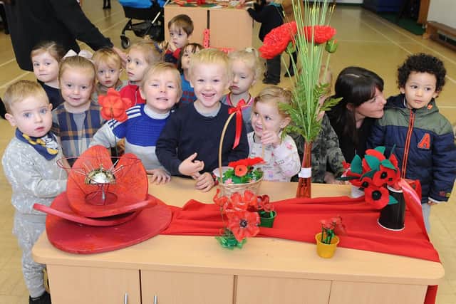 Manor Nursery school children exploring the poppies that were made. Picture : Habibur Rahman