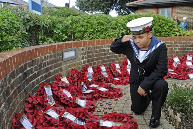 HMS Sultan RN Cadet Brodie Turner (10) pays his respects. Picture: Ian Hargreaves
