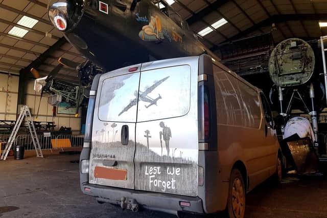Shaun Harvey, a 34-year-old gardener from New York, Lincolnshire, created the Remembrance Day artwork on a van using his finger and brushes. The van is parked in front of a Lancaster Bomber called Just Jane at Lincolnshire Aviation Heritage Centre Picture: Shaun Harvey/PA Wire