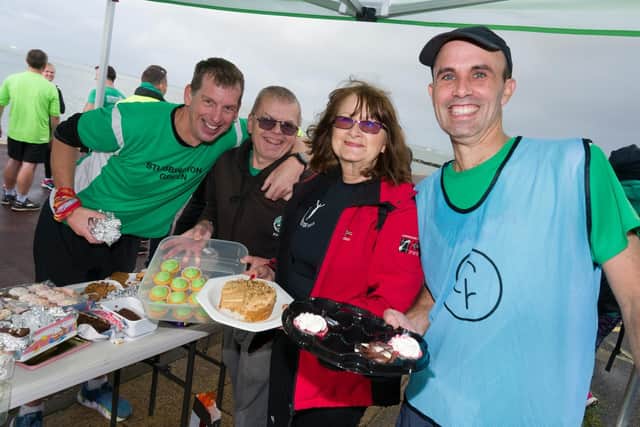 Lee-on-the-Solent parkrun volunteers provide free cakes. Left to right: Nigel Mitchell, Kevin Ashman, Wendy Rowe and Marcus Lee. Picture: Duncan Shepherd