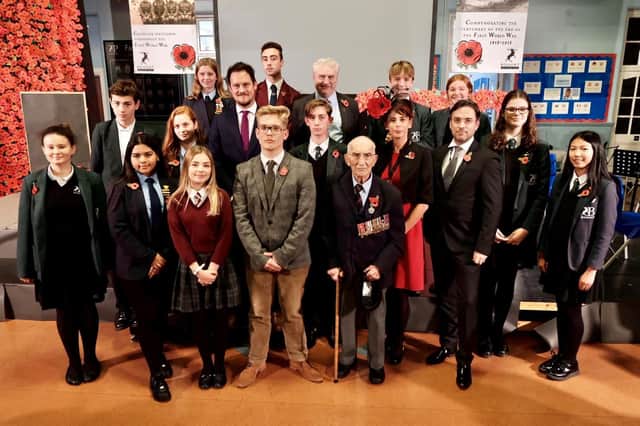 Staff students and dignitaries commemorate the school's role during the First World War