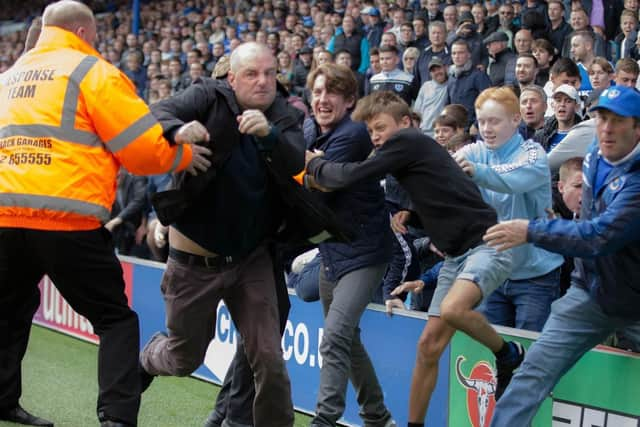 Fans on the pitch during the Pompey v Oldham match on September 30, 2017.