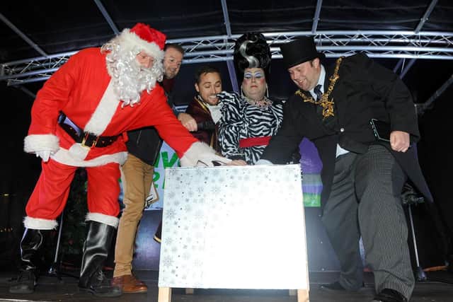 15/11/2018
Palmerston Road in Southsea, turned on their Christmas lights on Thursday November 15.
Pictured is: (l-r) Father Christmas, Wave 105's Michael Coombes, Marcus Patrick, Jack Edwards and The Lord Mayor of Portsmouth Lee Mason, turn on the Christmas lights.
Picture: Sarah Standing (180832-1068)