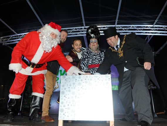15/11/2018

Palmerston Road in Southsea, turned on their Christmas lights on Thursday November 15.

Pictured is: (l-r) Father Christmas, Wave 105's Michael Coombes, Marcus Patrick, Jack Edwards and The Lord Mayor of Portsmouth Lee Mason, turn on the Christmas lights.

Picture: Sarah Standing (180832-1068)