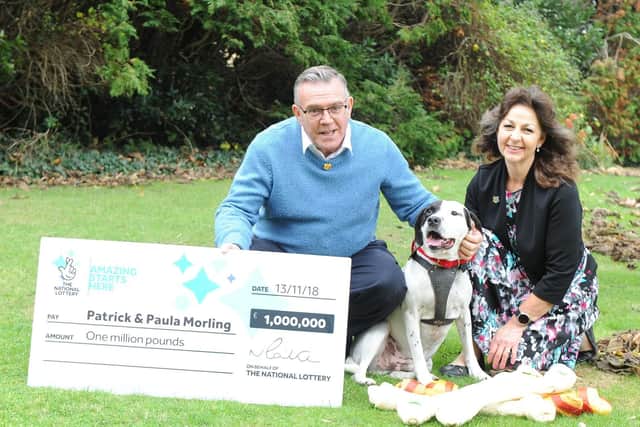Patrick and Paula Morling with Ollie, eight, who is the reason they won 1m on a National Lottery scratchcard. Picture: Habibur Rahman