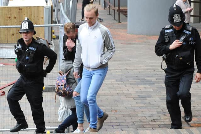Josh Thorne leaving court flanked by two police officers
Photo: Sarah Standing (180828-8822)
