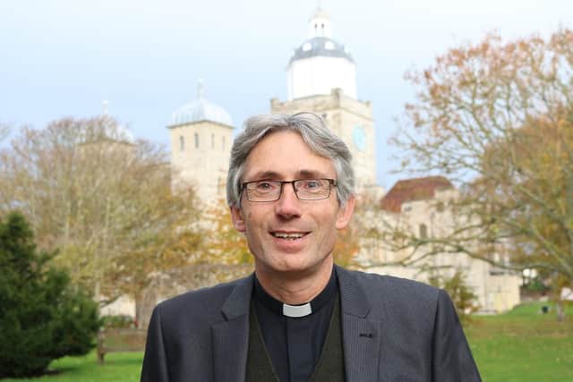 Canon Dr Anthony Cane outside Portsmouth Cathedral