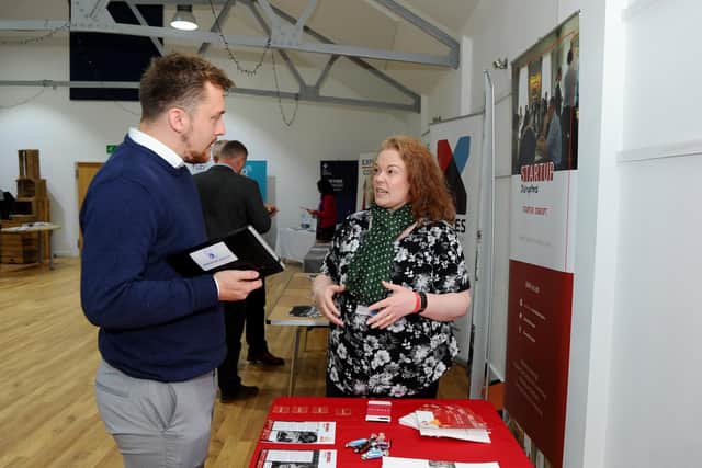 Reece Booker from Booker Media talking to Rebecca Lodge.
Picture: Sarah Standing (180834-1300)