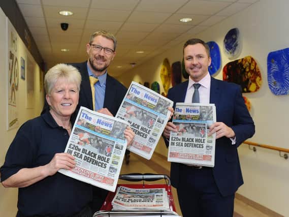 From left, QA newspaper seller Marion Emery, editor of The News Mark Waldron and chief executive of Portsmouth Hospitals NHS Trust Mark Cubbon
Picture: Sarah Standing (180833-1207)