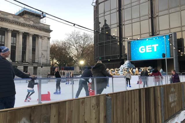 Skaters at the ice rink in Guildhall Square, Portsmouth