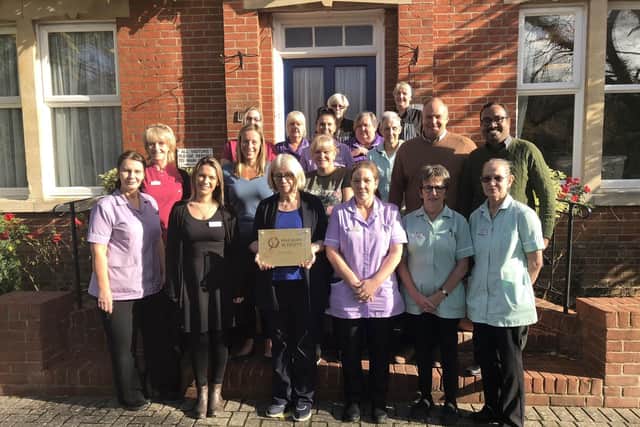 Staff from Wisteria Lodge are celebrating