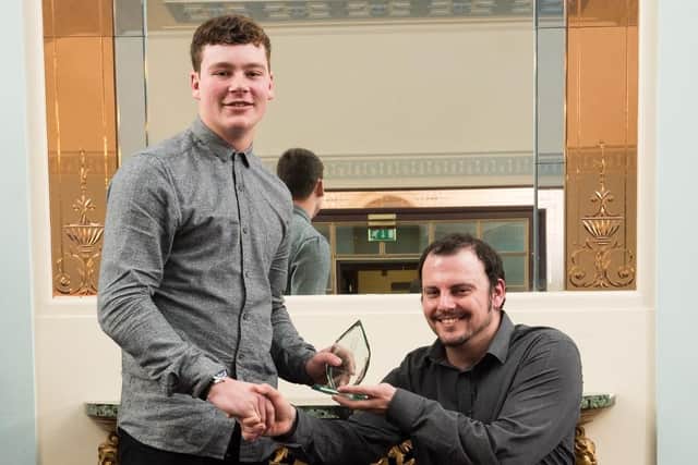 Oakley Way (17) receives the Personal Achievement Award from David Williamson, the 2016 award winner, at last year's event. Picture: Vernon Nash