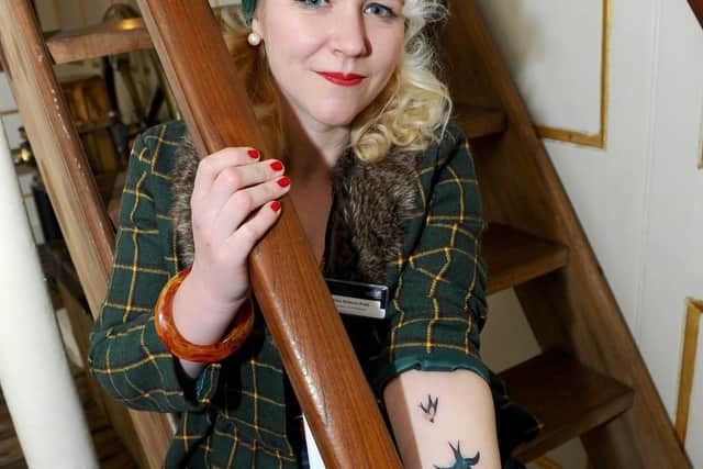 Curator (exhibitions) Alice Roberts-Pratt with her swallows tattoo.

Picture: Sarah Standing (180836-1378)