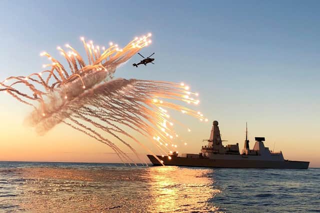 A Wildcat helicopter belonging to the Royal Navys Type 45 destroyer HMS Diamond test firing her defensive flare systems while on maritime security operations in the Mediterranean. Picture: Lt Cdr Oliver Clark/Royal Navy.