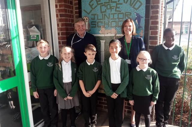 Left to right - Harry Wardle, 11, Elodie Kerr, 9, Edwin Vopson, 8, Ava Cross, 8, Emily Pattinson, 11 and Odira Ifeajuna, 9.
Back - chair of governors, Peter Metcalf and executive head teacher, Claire Wilson.