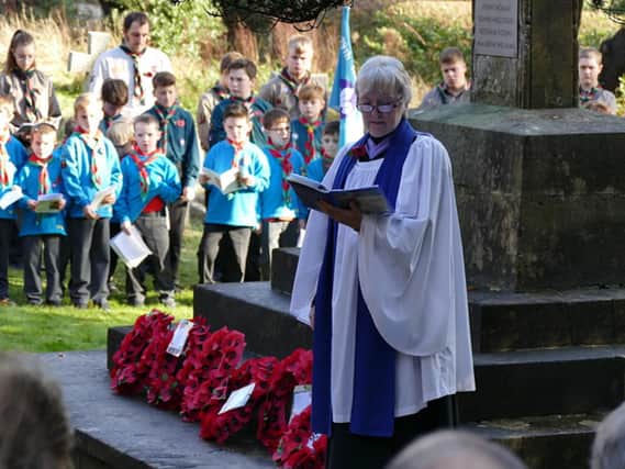 Janet Clarke leads the Remembrance Sunday service, which started outside St Peters Church in Curdridge