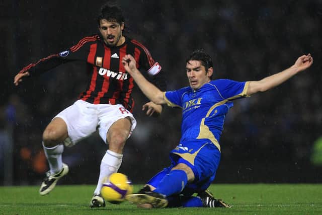 Pompey's Richard Hughes tackles AC Milan's Gennaro Gattuso