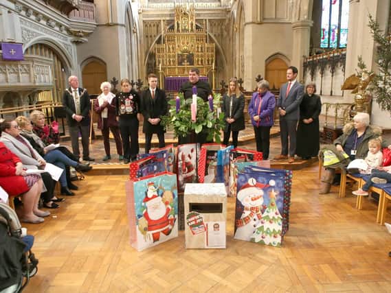 Bags of gift cards being handed out at last year's Comfort and Joy Christmas Campaign ceremony in St Mary's Church, Fratton.
Picture : Habibur Rahman