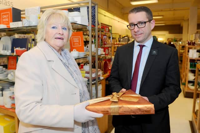 Gillian Price with Neil Vallender, section manager at Knight & Lee in Southsea. Picture: Sarah Standing