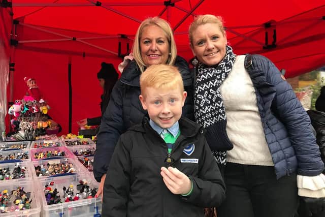 Jane Newnham, 60, Lynsey Newnham, 39, and her son Ashton, eight enjoying the Lego stall at the Love Baffins Christmas Market