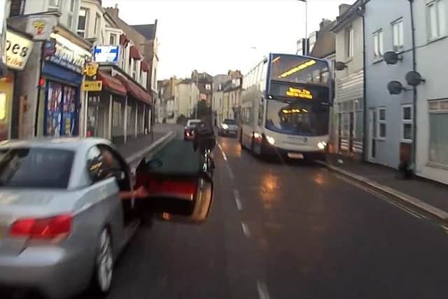Dramatic moment motorcyclist is thrown under moving bus after swerving ...