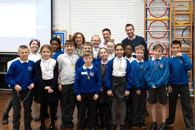 The winning teams with the judging panel at the back of the photo - from left to right,  Cllr Suzy Horton, cabinet member for education at Portsmouth City Council; Matthew Olive, headteacher at St Swithun's Catholic Primary School; Rupert Teasdale, coastal engineer from the Eastern Solent Coastal Partnership. Picture: David Bartholomew.